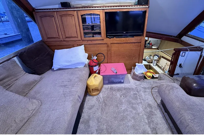 Slide: The Image of Interior of 1978 Marine Management 48 Sport Fish with cozy seating and entertainment area. - 27