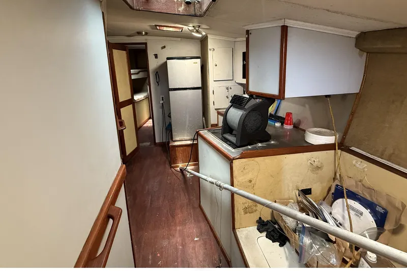 Slide: The Image of 1978 Marine Management 48 Sport Fish interior with kitchen and hallway view. - 30
