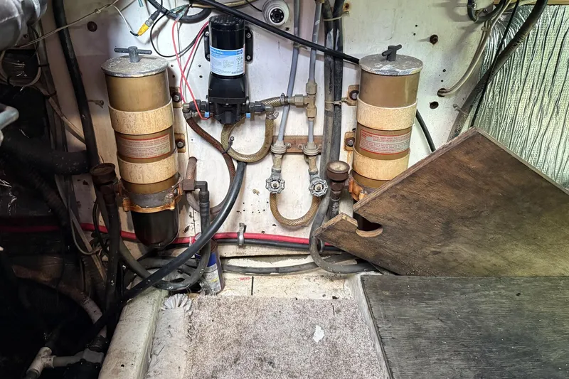 Slide: The Image of Engine room of 1978 Marine Management 48 Sport Fish boat with fuel filters and wiring. - 40