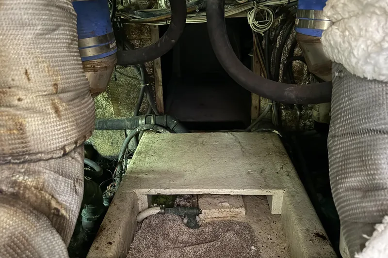 Slide: The Image of Engine room of 1978 Marine Management 48 Sport Fish boat, showing pipes and machinery. - 41