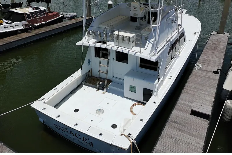 Slide: The Image of 1978 Marine Management 48 Sport Fish boat docked at marina, aerial view. - 5
