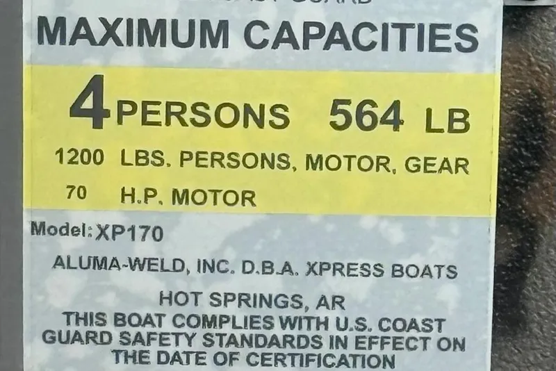 Slide: The Image of 2026 Express Xp170 boat capacity label, 4 persons, 564 lbs, 70 HP motor. - 10