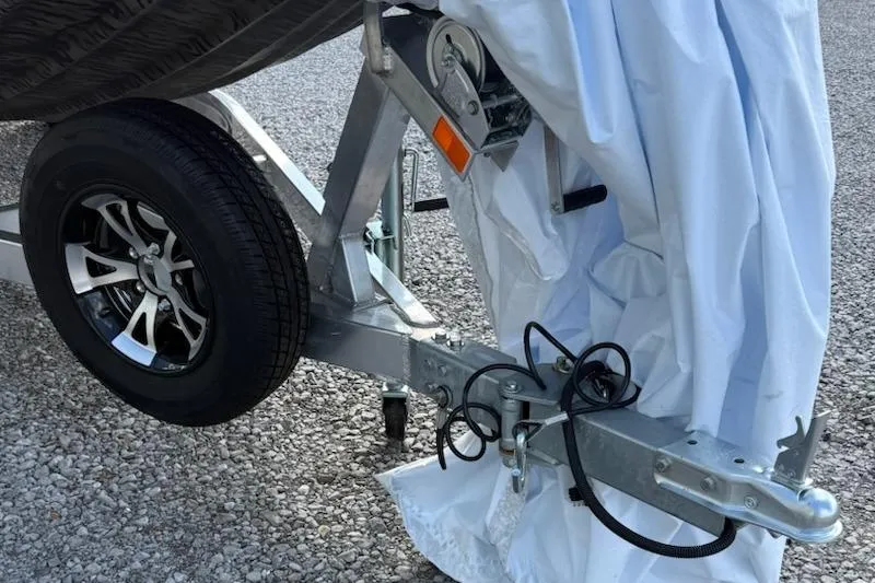 Slide: The Image of Trailer hitch and wheel of 2026 Express Xp170 on gravel surface. - 8