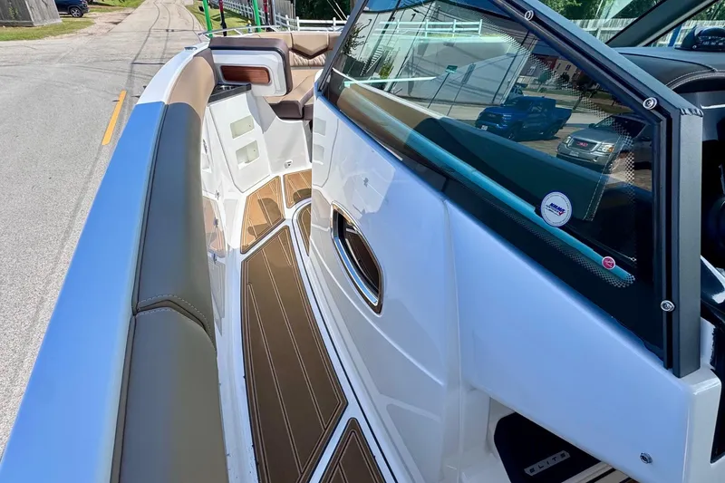 Slide: The Image of 2026 Monterey Elite 30 OB boat interior with sleek seating and modern design. - 14