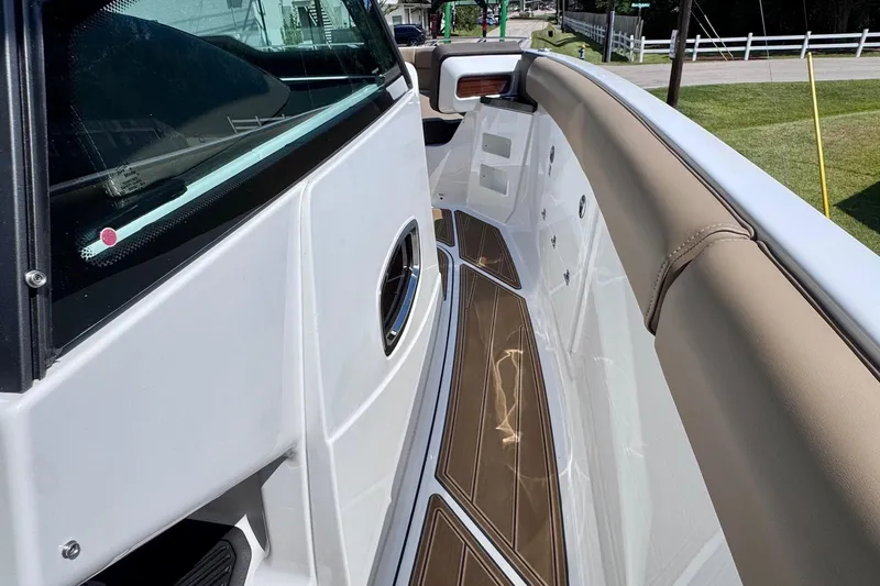 Slide: The Image of 2026 Monterey Elite 30 OB boat interior with sleek design and luxurious seating. - 16