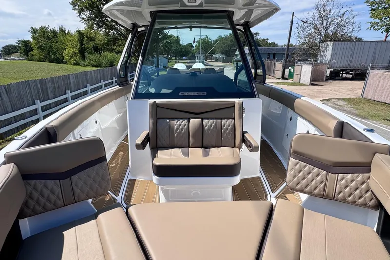 Slide: The Image of 2026 Monterey Elite 30 OB boat interior with luxurious seating and modern design. - 18