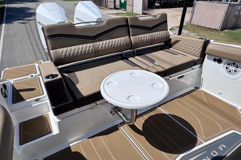 Slide: The Image of 2026 Monterey Elite 30 OB boat interior with luxurious seating and table setup. - 7