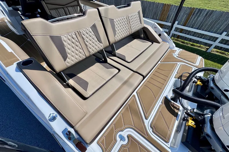 Slide: The Image of 2026 Monterey Elite 30 OB boat with luxurious seating and modern design. - 8