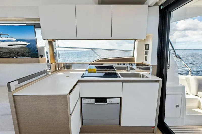 Slide: The Image of Modern kitchen on 2023 Prestige 460 Flybridge yacht with ocean view. - 12