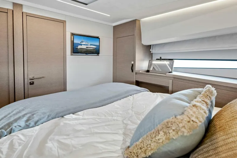 Slide: The Image of Luxurious bedroom interior of 2023 Prestige 460 Flybridge yacht with modern decor. - 34