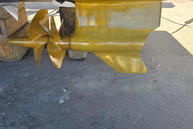 Slide: The Image of Propeller and rudder of 2023 Prestige 460 yacht, displayed on a dry dock. - 69