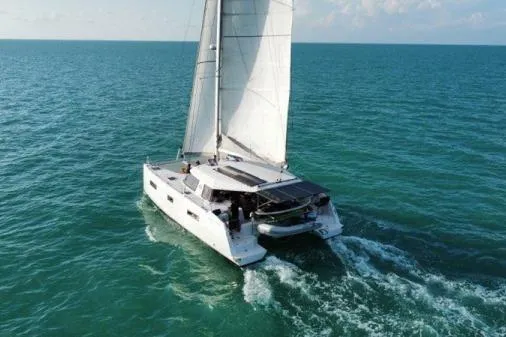 The Image of Sailing catamaran Nautitech 40 Open 2016 gliding on turquoise ocean waters. - 1