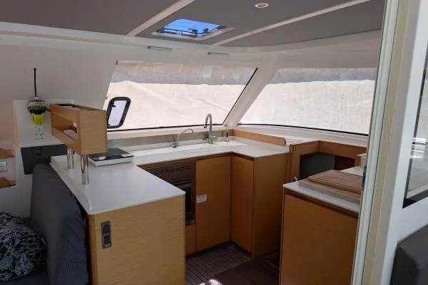Slide: The Image of Interior of 2016 Nautitech 40 Open catamaran with modern kitchen and panoramic windows. - 11