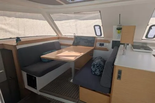 Slide: The Image of Interior of 2016 Nautitech 40 Open catamaran with modern seating and dining area. - 12