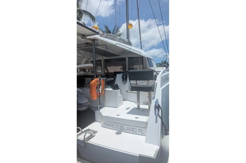 Slide: The Image of 2016 Nautitech 40 Open catamaran docked at Marco Island, Florida, under a sunny sky. - 21