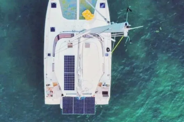Slide: The Image of Overhead view of 2016 Nautitech 40 Open catamaran with solar panels on turquoise water. - 34