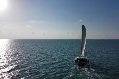 Slide: The Image of Sailing catamaran Nautitech 40 Open 2016 on open sea under clear sky. - 36