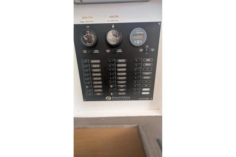 Slide: The Image of Control panel of a 2016 Nautitech 40 Open catamaran with gauges and switches. - 41