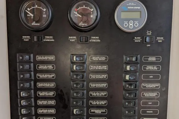 Slide: The Image of Control panel of a 2016 Nautitech 40 Open catamaran with gauges and switches. - 42