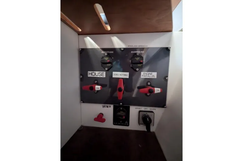 Slide: The Image of Control panel of a 2016 Nautitech 40 Open catamaran with switches and labels. - 43