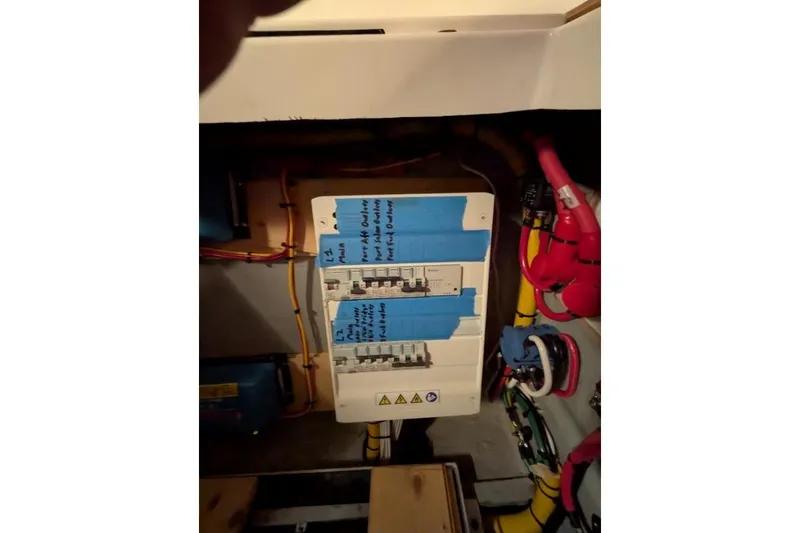 Slide: The Image of Electrical panel on a 2016 Nautitech 40 Open catamaran with labeled circuit breakers. - 47