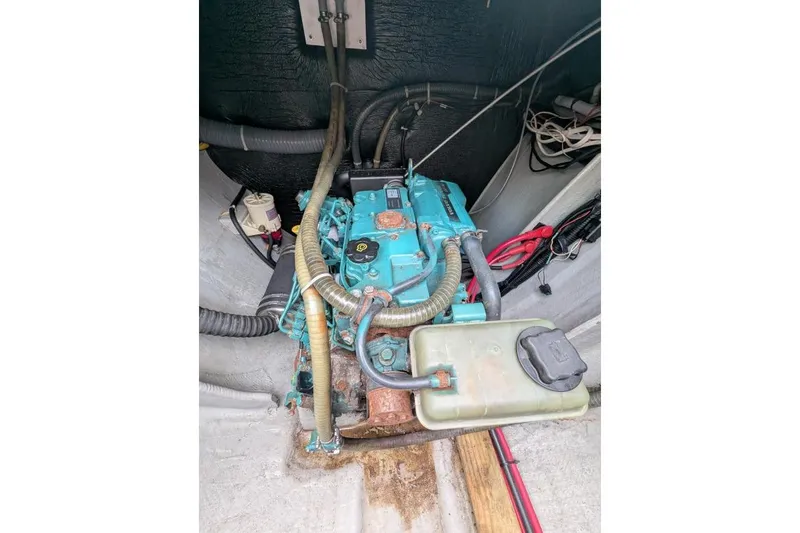 Slide: The Image of Engine compartment of a 2016 Nautitech 40 Open catamaran, featuring visible hoses and wiring. - 50