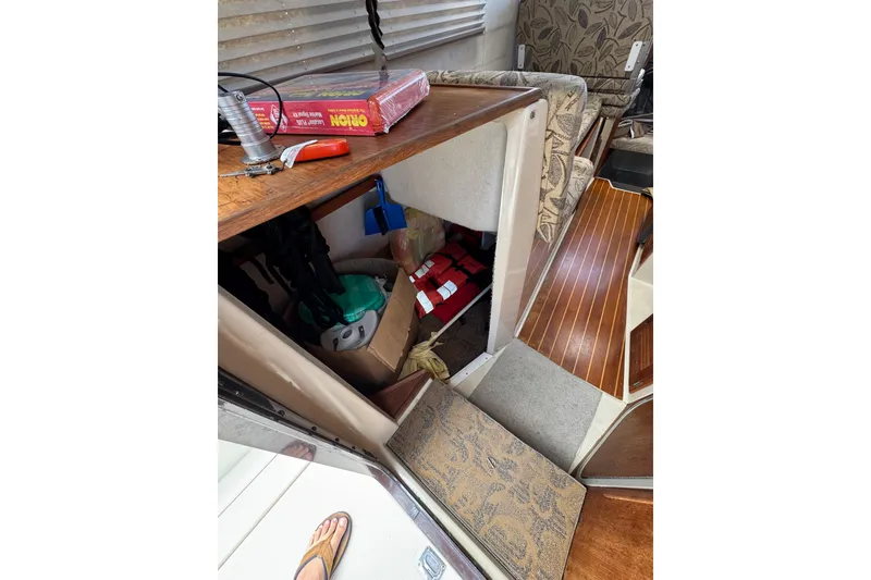 Slide: The Image of Interior of 2008 Ranger Tugs R-25 Classic with storage area and wooden flooring. - 16