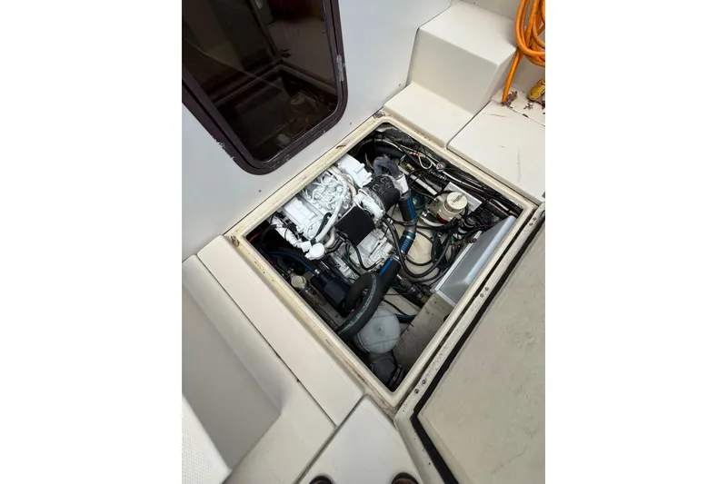 Slide: The Image of Engine compartment of 2008 Ranger Tugs R-25 Classic boat, showcasing mechanical components. - 6