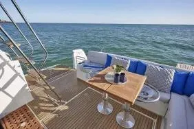 Slide: The Image of 2026 Beneteau Antares 12 yacht deck with seating and ocean view. - 9