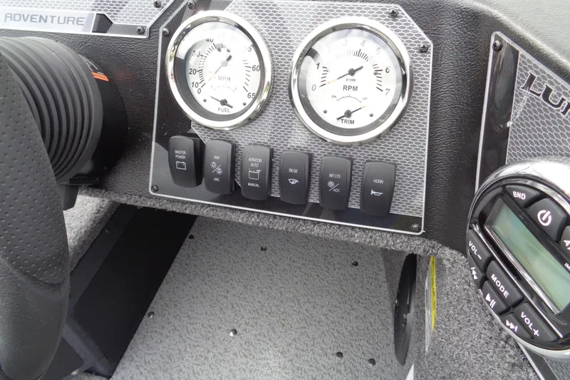 Slide: The Image of Dashboard of 2026 Lund 1675 Adventure SS boat with gauges and control buttons. - 15