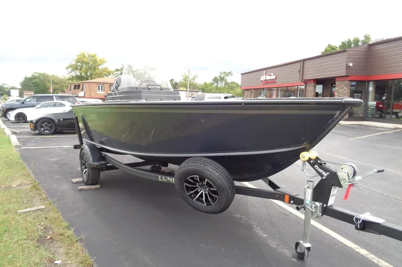 Slide: The Image of 2026 Lund 1675 Adventure SS boat on trailer in parking lot. - 7