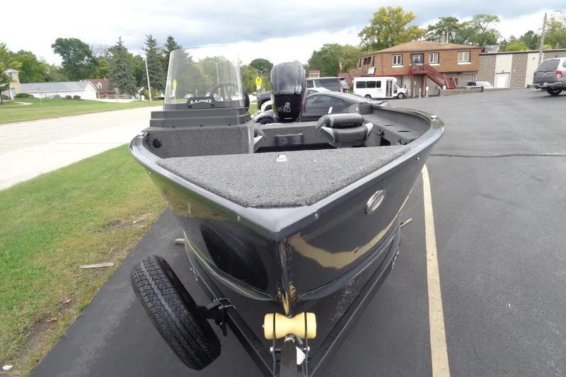 Slide: The Image of 2026 Lund 1675 Adventure SS boat on trailer, parked outdoors. - 8