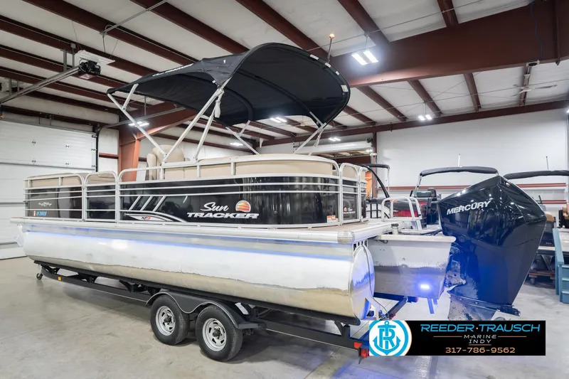 Slide: The Image of 2020 Sun Tracker Party Barge 24 DLX pontoon boat in indoor showroom. - 10