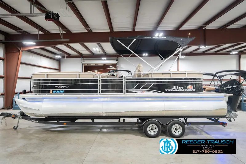 Slide: The Image of 2020 Sun Tracker Party Barge 24 DLX pontoon boat in indoor showroom. - 11