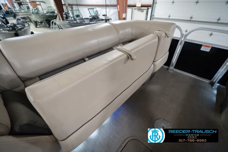 Slide: The Image of 2020 Sun Tracker Party Barge 24 DLX interior seating in showroom. - 24
