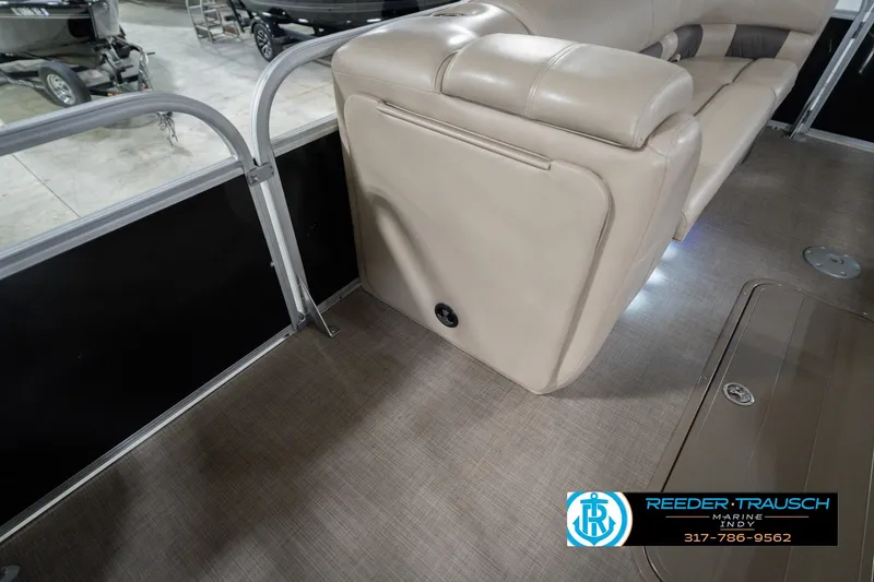 Slide: The Image of 2020 Sun Tracker Party Barge 24 DLX interior with beige seating and flooring. - 28