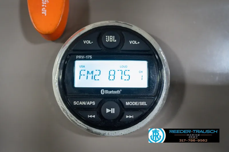 Slide: The Image of JBL PRV-175 marine radio displaying FM2 87.5, installed on a 2020 Sun Tracker Party Barge 24 DLX. - 37
