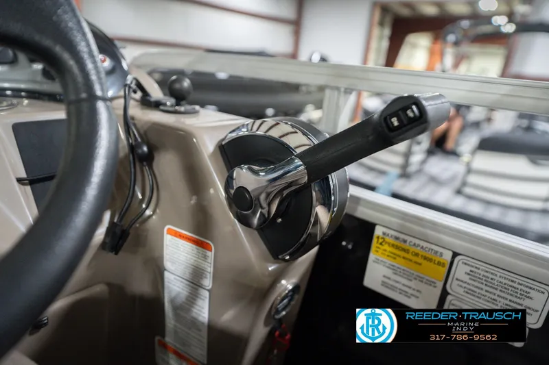 Slide: The Image of Close-up of 2020 Sun Tracker Party Barge 24 DLX steering and throttle controls. - 42