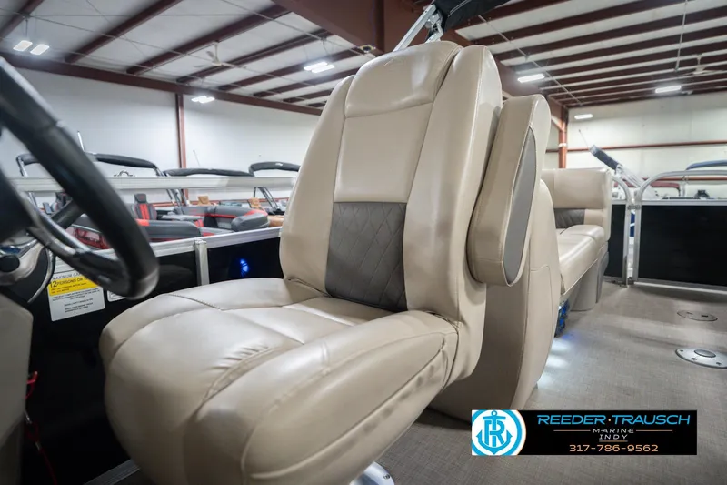 Slide: The Image of 2020 Sun Tracker Party Barge 24 DLX interior seating in showroom. - 43