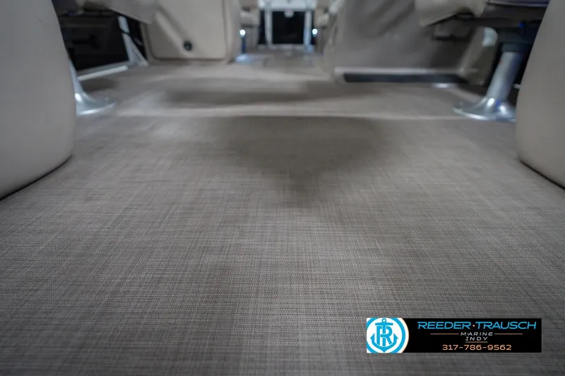 Slide: The Image of 2020 Sun Tracker Party Barge 24 DLX interior flooring, beige texture, Reeder Trausch Marine logo. - 50