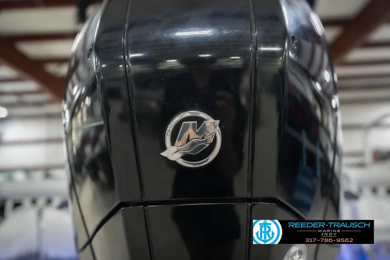 Slide: The Image of Close-up of a 2020 Sun Tracker Party Barge 24 DLX engine with logo in a showroom. - 53