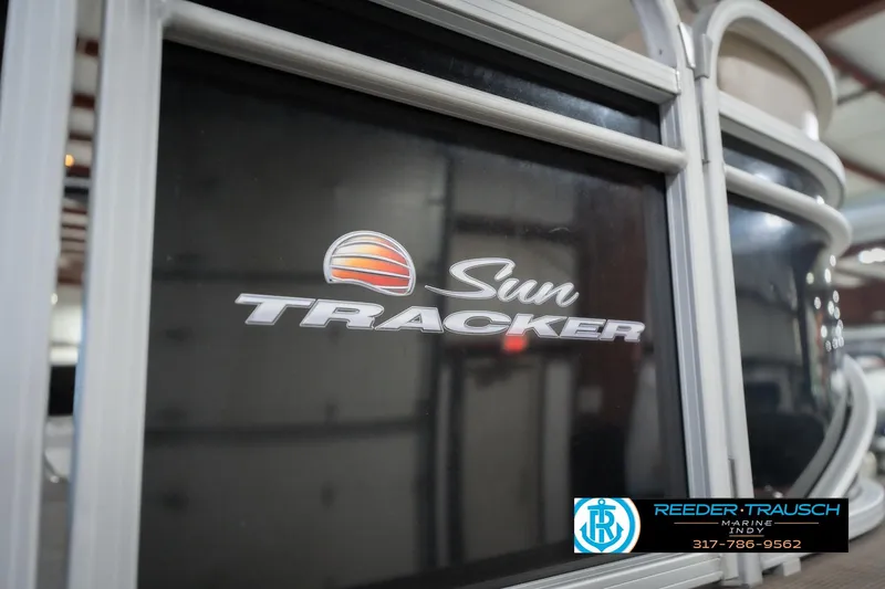 Slide: The Image of 2020 Sun Tracker Party Barge 24 DLX logo on boat exterior. - 55