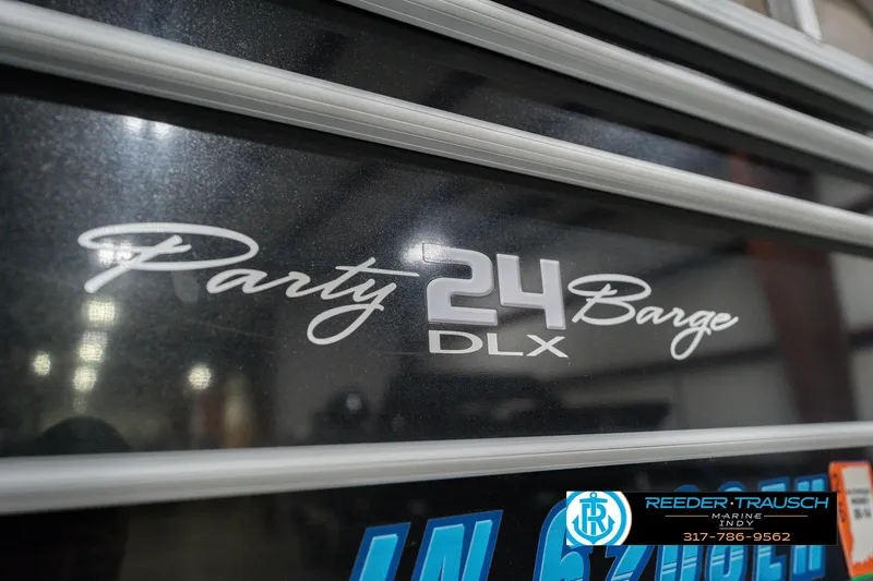Slide: The Image of 2020 Sun Tracker Party Barge 24 DLX logo on boat exterior. - 56