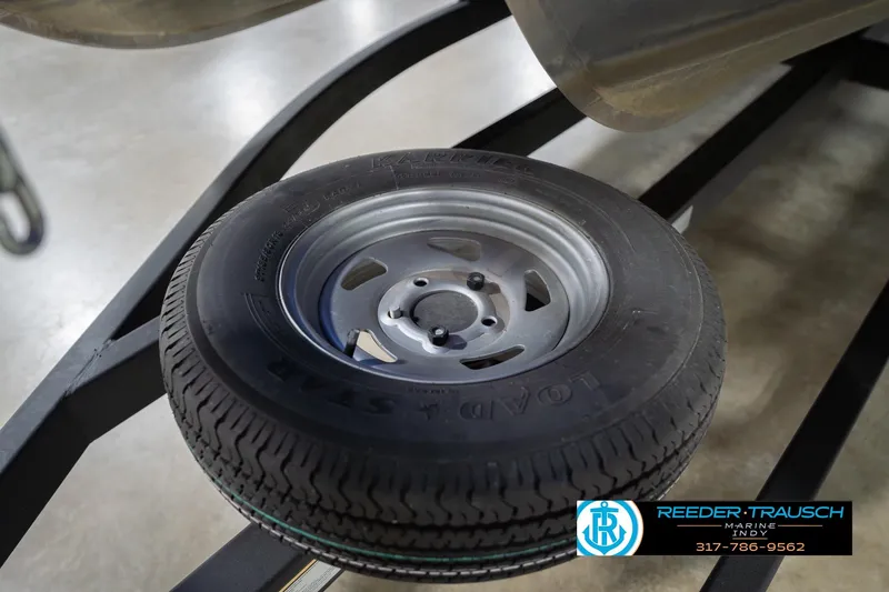 Slide: The Image of Trailer tire on a 2020 Sun Tracker Party Barge 24 DLX, displayed at Reeder-Trausch Marine. - 59