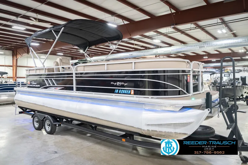 Slide: The Image of 2020 Sun Tracker Party Barge 24 DLX pontoon boat in showroom, on trailer. - 6