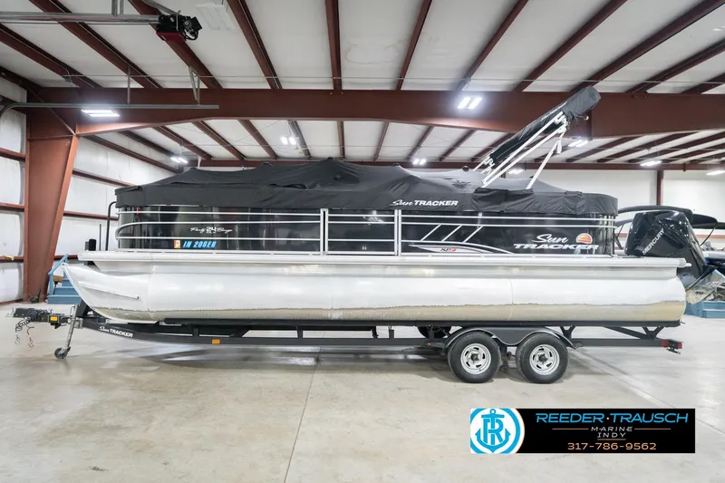 Slide: The Image of 2020 Sun Tracker Party Barge 24 DLX pontoon boat in indoor storage facility. - 61