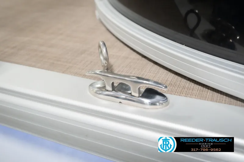 Slide: The Image of 2020 Sun Tracker Party Barge 24 DLX boat cleat detail with Reeder-Trausch Marine logo. - 63