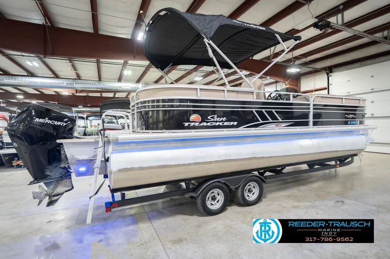 Slide: The Image of 2020 Sun Tracker Party Barge 24 DLX pontoon boat in indoor showroom. - 8