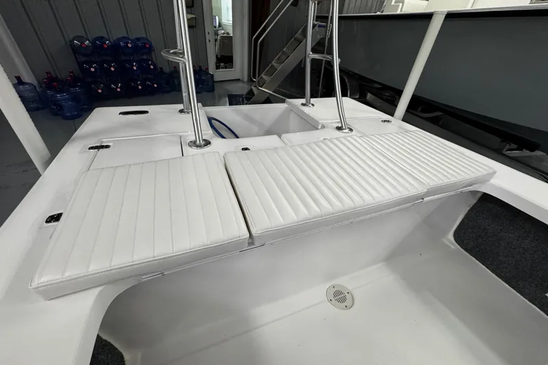 Slide: The Image of Interior view of 2026 Mitzi Skiffs 17 Tournament boat with open storage compartments. - 11
