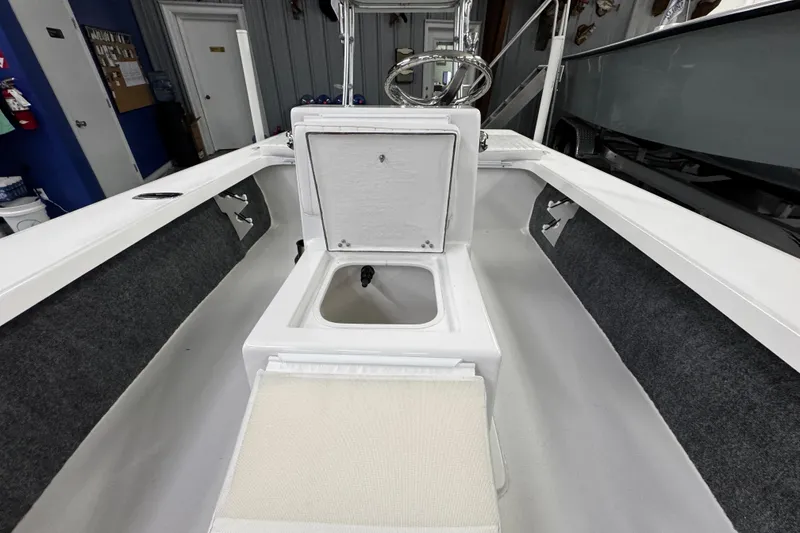 Slide: The Image of Interior view of a 2026 Mitzi Skiffs 17 Tournament boat, showcasing storage and seating. - 14